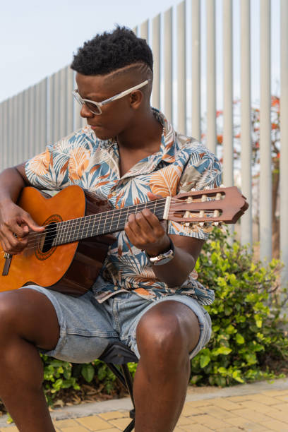 istock Guitarist in Casual Outdoor Performance 2151044434