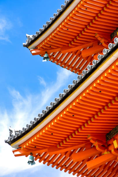 Kyoto, Japan - October 10th, 2023: Detailed Close-up view of the decorative red Kiyomizu-dera Pagoda under a blue autumn sky in Kyoto Japan.