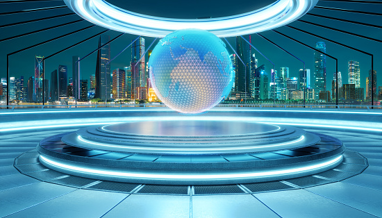 Dazzling hologram of a globe illuminates a modern city platform at night