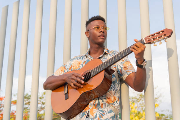 istock Urban Guitarist Enjoying a Sunny Afternoon 2151044593