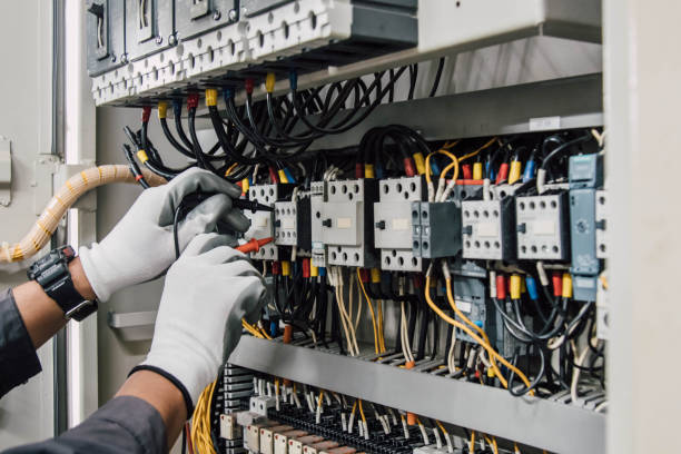 istock Electrician engineer tests electrical installations and wires on relay protection system. 2151045569