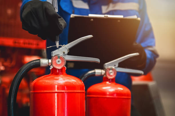 istock Engineer check fire extinguisher tank in the fire control room for safety in factory or industry. 2151045586
