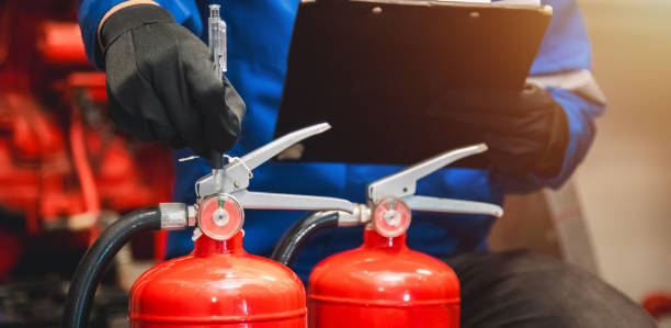 istock Engineer check fire extinguisher tank in the fire control room for safety in factory or industry. 2151045587