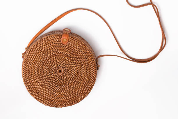 istock Stylish round straw bag isolated on the white background, top view 2151046328