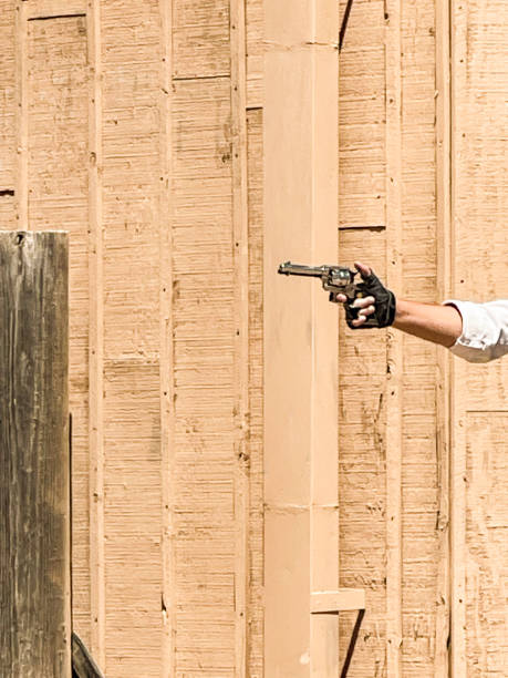 istock Hand holding a vintage revolver 2151046947