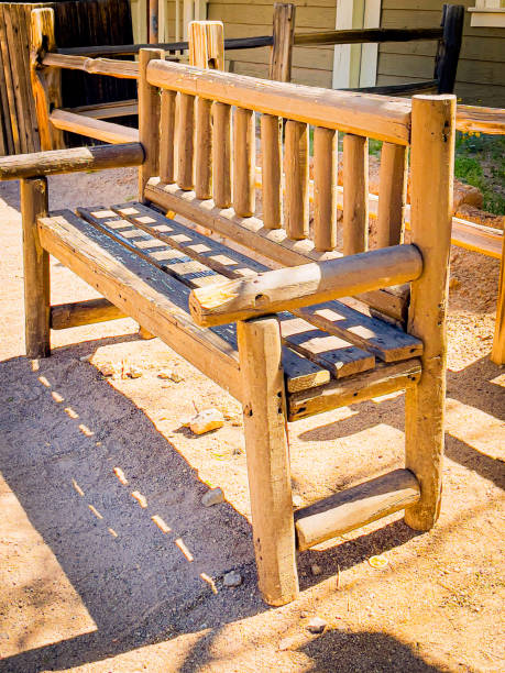 istock Vintage bench in front of a house 2151047001