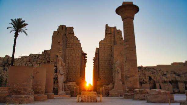 Incredible bright orange sunset on the Giza pyramids in Egypt. Sunset in Cairo. Silhouette of pyramids
