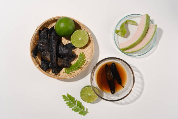 istock Template with a group of ingredient for producing cosmetic or shampoo with black locust seed pods is the main ingredient from high angle shot. Blank space for advertising and presentation 2151049713