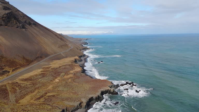 Aerial Drone Fly Iceland Blue Skyline with Atlantic Ocean Waves Sandy Cliff Side