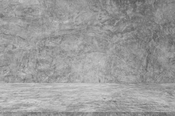 istock Wall empty studio interior background and backdrop of concrete cement wall in black and gray tones. Studio interior background and empty space Decorating ideas 2151054667