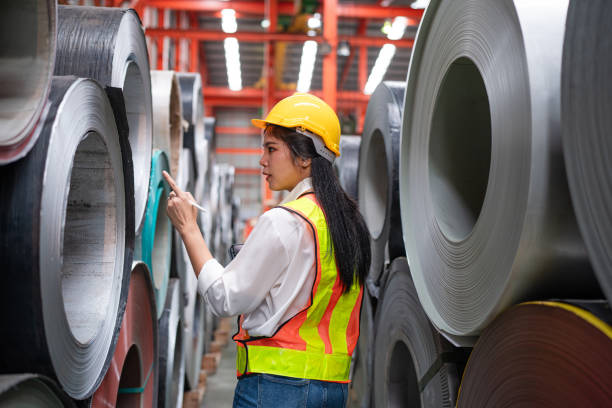 istock women staff worker Standing counting and inspecting products. 2151055749