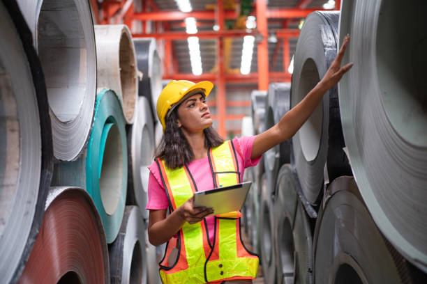 istock women staff worker Standing counting and inspecting products. 2151055820