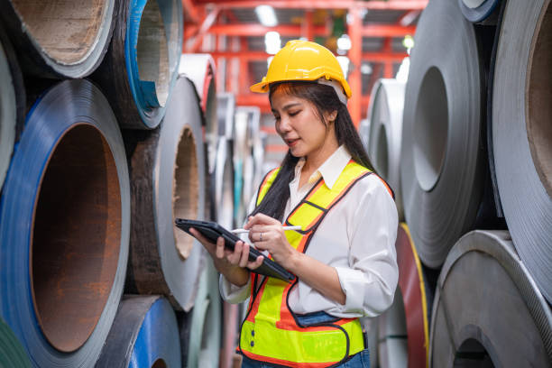 istock women staff worker Standing counting and inspecting products. 2151055912