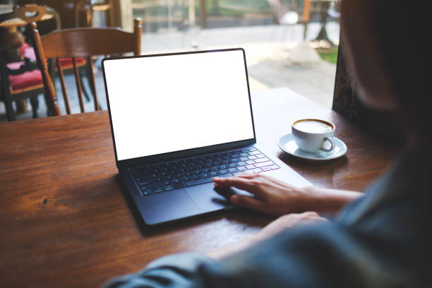 istock Mockup image of a woman working and touching on laptop computer with blank white desktop screen 2151056109
