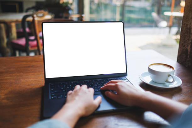 istock Mockup image of a woman working and typing on laptop computer with blank white desktop screen 2151056112