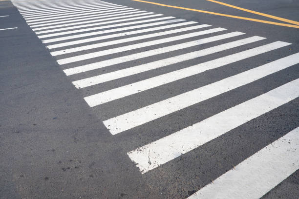 istock Image of an empty pedestrian crosswalk with no people. Zebra cross. 2151056428