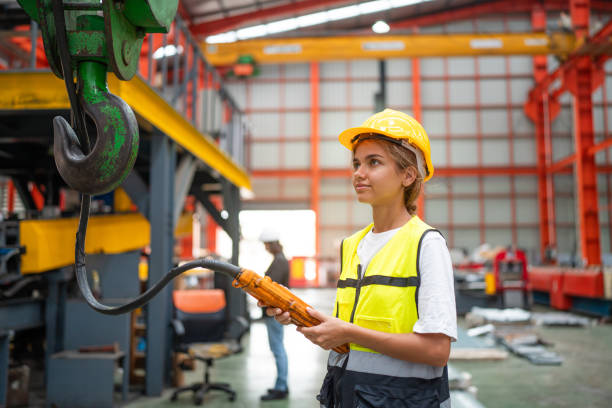 istock Female engineer or factory worker using tablet Monitoring Production Conveyor. 2151056521
