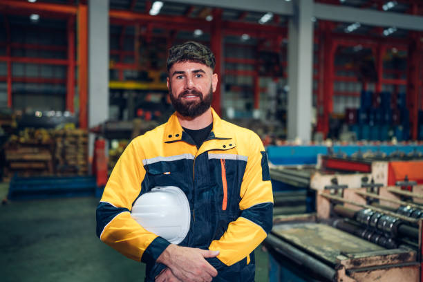 istock Portrait of Smiling Professional Industry Engineer standing and looking camera. 2151057651