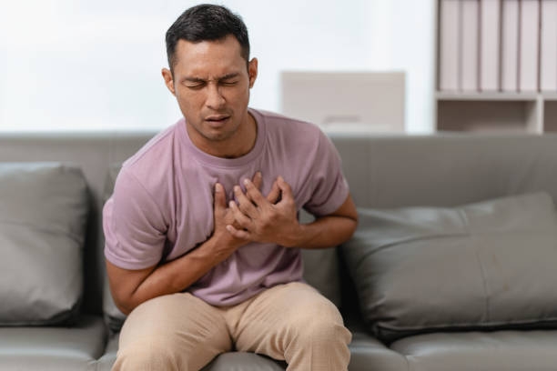 istock Man touching heart with heart disease concept suffering Contractions and difficulty breathing Chest pain or heart attack, life insurance, health care concept 2151061204