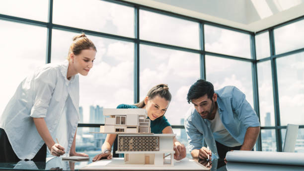 istock Professional architect team working together to design house model. Tracery. 2151062997