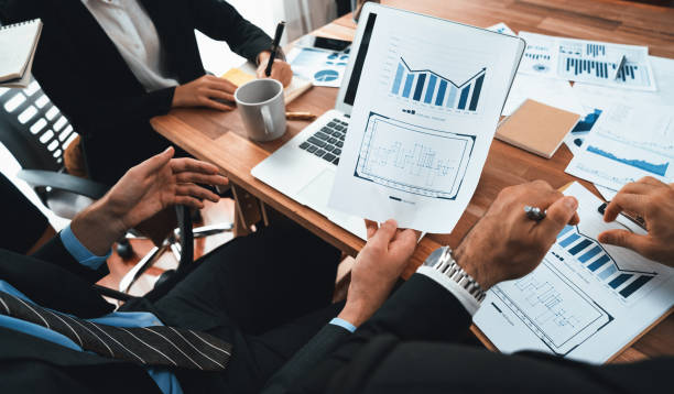 istock Group of business analyst team analyzing financial data report. Habiliment 2151063952