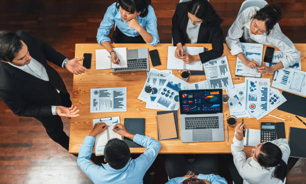 istock Wide top view diverse analyst team analyzing financial data. Habiliment 2151064104