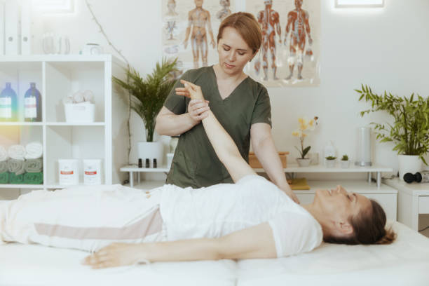 istock pensive female therapist in massage cabinet doing checkup 2151064307