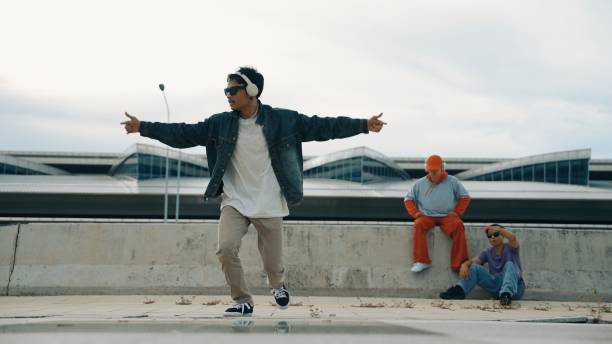 istock Break dancer enjoy perform freestyle movement with friend cheering. Sprightly. 2151064796