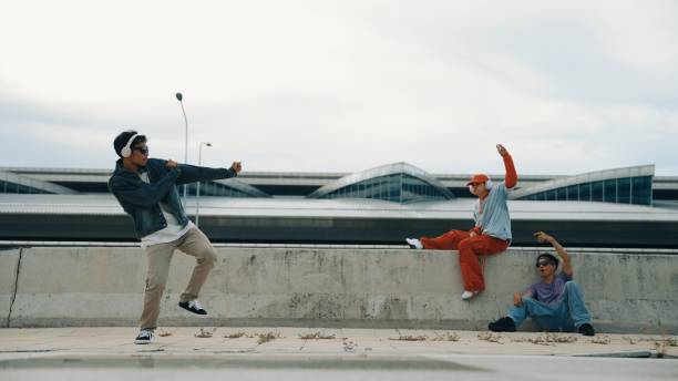 istock Break dancer enjoy perform freestyle movement with friend cheering. Sprightly. 2151064833