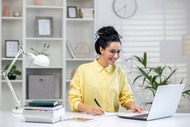 istock Productive professional woman working at a home office with a laptop 2151065111