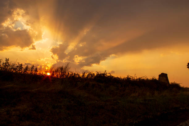 sunset on ancient roman roadof appian way