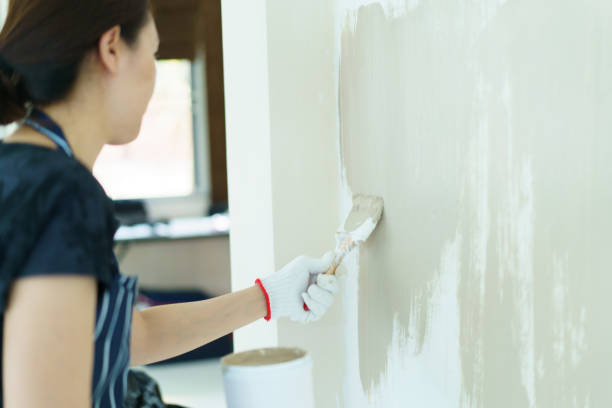 istock Woman painting the wall by herself. 2151066548