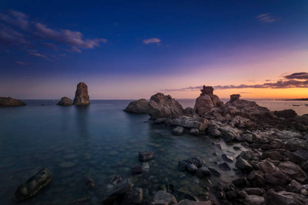 istock view of Acitrezza at sunset 2151066775