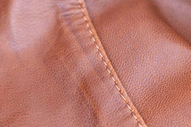 istock Leather texture background. Part of perforated brown leather details. Perforated leather texture background. Texture leather 2151066977