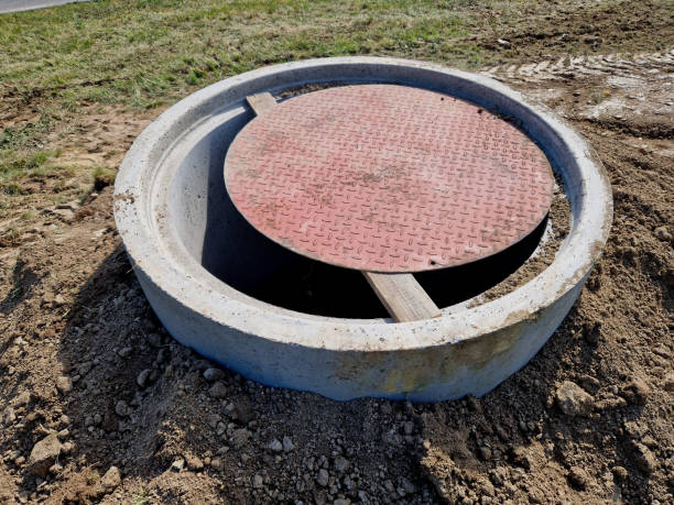 istock badly secured shaft is a risk for children to fall into the depth. the well has a small tin lid supported by a beam. insufficient security solutions to secure against entry 2151068977