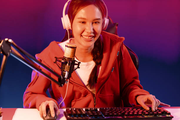 istock Host channel smiling Asian wearing headphone recording on phone. Stratagem. 2151068997