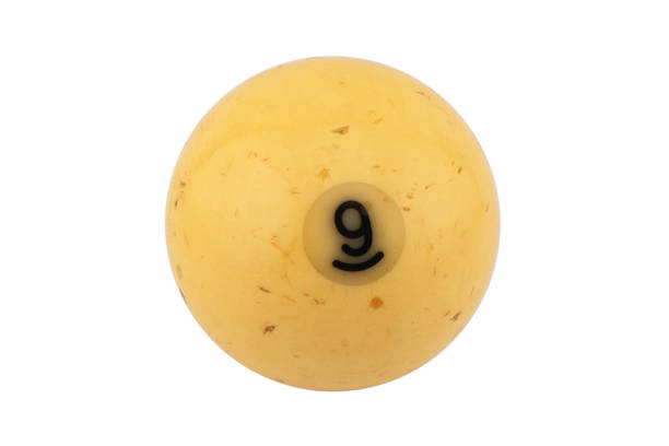Studio shot of a single number one worn pool ball sitting on a white back lit seamless background