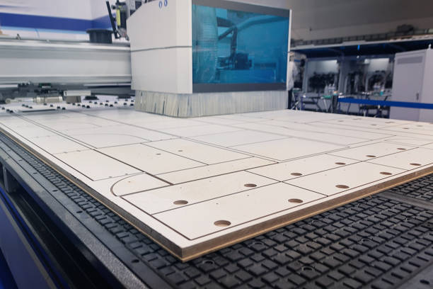 Modern machine for cutting chipboard at a furniture factory. Industry