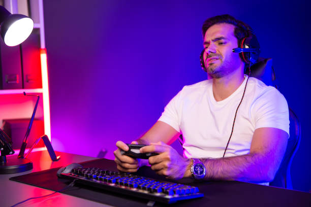 istock Streamer talking with team member players with joystick control game. Surmise. 2151069870