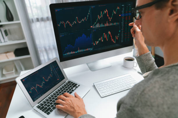 istock Business trader using computer and laptop to search high profit. Pecuniary. 2151070424