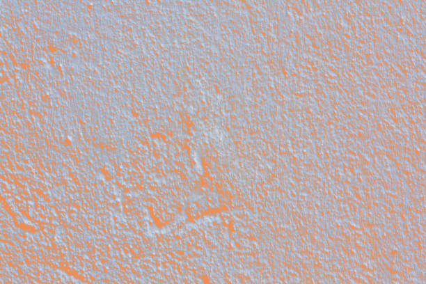 Grey background abstract texture with Light red orange granules and patches.