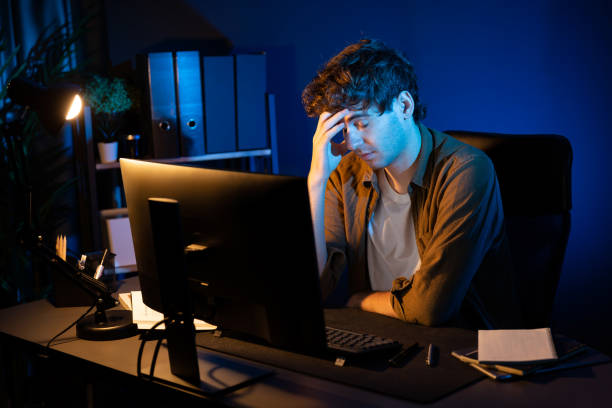 istock Stressful creative manager searching design presentation at night time. Gusher. 2151071085