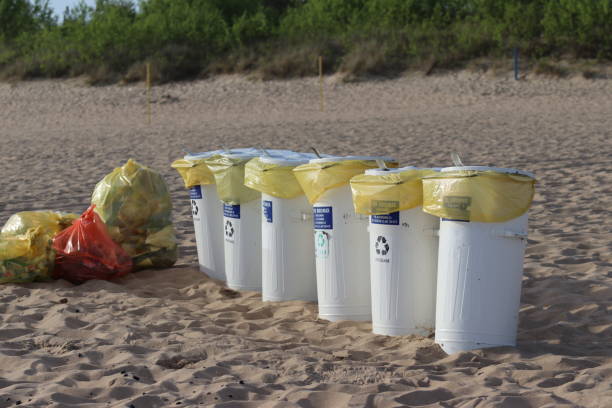 istock Buckets of garbage on the beach. Segregated waste 2151073013