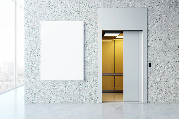 istock Elevator with open doors beside a blank white billboard in a modern lobby. 3D Rendering 2151073784
