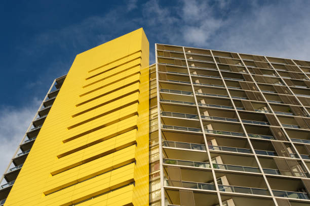 istock Yellow building against a cloudy sky 2151074655