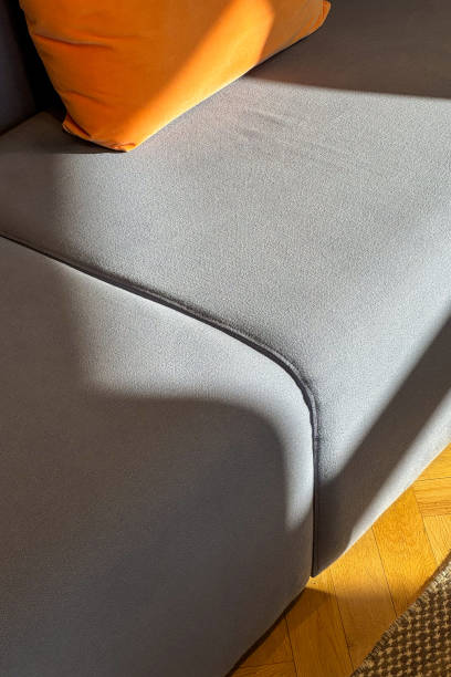 istock Close up of comfy sofa with cushion on grey upholstery 2151074965