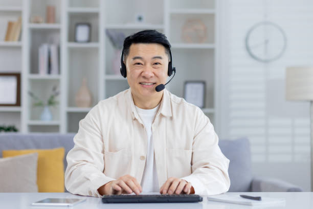 istock Professional man working from home with headset and smile 2151075085