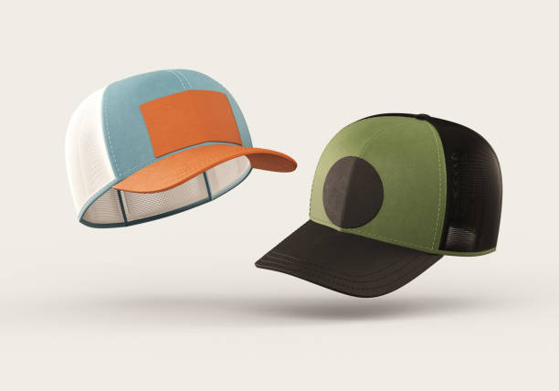 istock Two floating trucker caps mockup with blank logo space for branding design isolated on a neutral background in realistic 3D rendering. Baseball hat template and sport apparel concept 2151075128