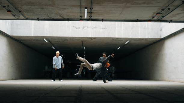 istock Long shot of hipster group dance together while perform b-boy dance. Sprightly. 2151076226