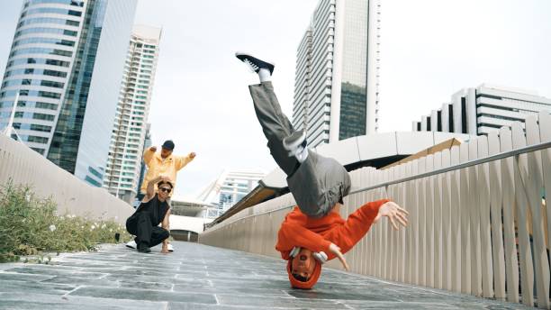 istock Young happy hipster perform break dancing or foot step with friend. Sprightly. 2151076627